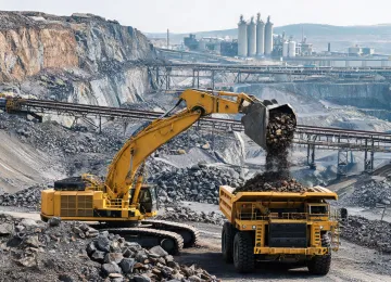 Open pit ore extraction feeding haul trucks